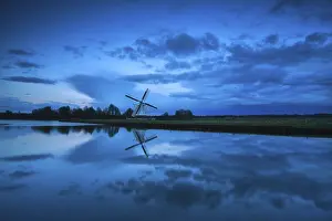 Central Europe Cloudscape Drucke: Dutch windmill and clouds in dusk reflected in river