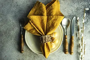 Traditional Easter Meal Setup Drucke: Easter dinner place setting on concrete background
