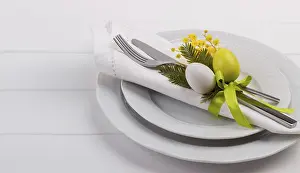 White Wooden Table Background Drucke: Easter dinner table setting on white wooden table
