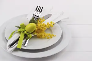 White Wooden Table Background Drucke: Easter dinner table setting on white wooden table