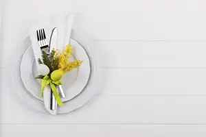 White Wooden Table Background Drucke: Easter dinner table setting on white wooden table