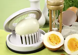 Boiled Eggs Drucke: Egg slicer with boiled eggs and an egg timer