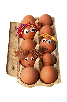 Funny Food Photography Drucke: Eggs with faces in an egg box