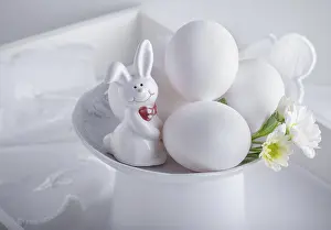 Colorful Easter Decorations Drucke: Eggs Rabbit and flowers on white surface