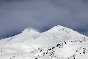 Snow Capped Mountain Drucke: Elbrus is a two-peak cone of a volcano