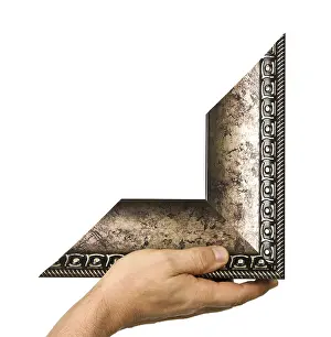 Isolated Picture Frame Drucke: Element of the frame in hand isolated on a white background