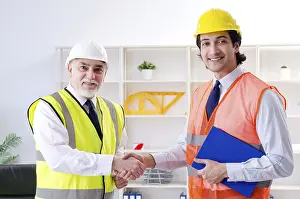 One Person Working Drucke: Two engineers colleagues working under project