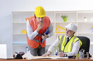 One Person Working Drucke: Two engineers colleagues working under project