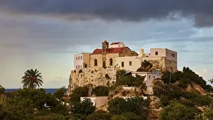 Deserted Church Building Greece Drucke: Entire monastery on rocks, evening light