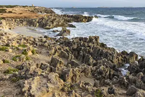 Uninhabited Rocky Shoreline Drucke: Eroded rocks on the beach of Salines
