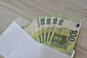 Office Supplies Stationery Drucke: Many one hundred euro notes in an envelope on a table