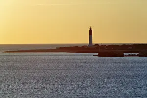 Backlit Lighthouse Photo Drucke: Evening atmosphere at the lighthouse