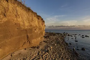 Atmospheric Evening Light In Europe Drucke: Evening light over the beach and cliffs in Klein Zicker