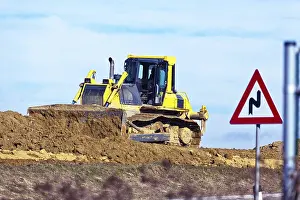 European Construction Site Drucke: An excavator on a construction site during construction work