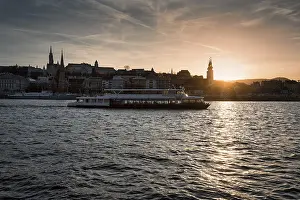 Passenger Ship At Sunset Drucke: Excursion boat on the Danube, sunset