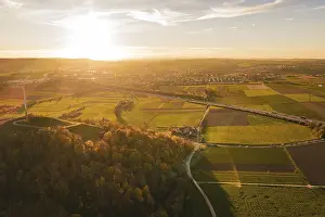 Central European Evening Light Drucke: Extensive fields and forests under a wide sky at sunset