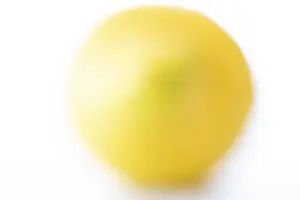 Citrus Fruit Image Drucke: Extracts, blurred lemon on a white background