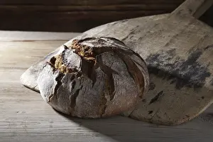 Bread Loaf Photography Drucke: Farmhouse bread on an old bread slide