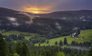 Stormy Weather In Europe Drucke: Some farms, surrounded by meadows and forest