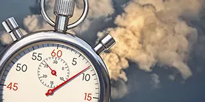 Climate Protection Image Drucke: Fast reduce emissions. A stop clock with emissions in background