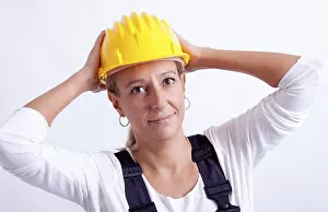Female Construction Worker Drucke: Female construction worker with tools on white background