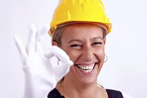 Safety Helmet Image Drucke: Female construction worker with tools on white background