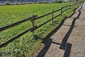 Rural Bavaria Landscape Drucke: Fence with a shadow along the promenade path
