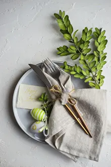 Plain White Background Photo Drucke: Festive table setting for Easter dinner on white background with copy space