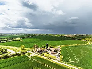 Top Down View Of Farmland Drucke: Fields and Windmill from a drone