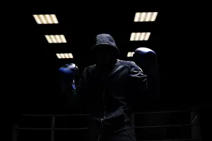 Young Sportsman Drucke: Fighter without a face is standing with his hands up