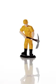 Symbolic Construction Image Drucke: Figure of a construction worker with hard hat and pickaxe