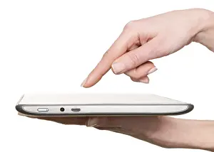 Woman Using Tablet Drucke: Finger pointing at a tablet computer screen