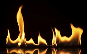 Dark Background Flames Drucke: Fire on a black background. Studio shot flames