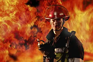 Protective Clothing For Firefighters Drucke: Firefighter in front of a wall of fire