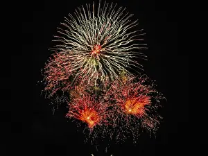 Text Free Space Photo Drucke: Fireworks in front of black background