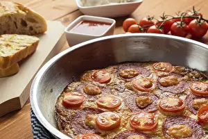 Homemade Meal Ideas Drucke: Fittata in a pan on brown breakfast table