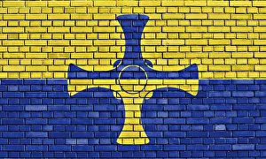 European Nationality Symbol Drucke: Flag of Durham painted on brick wall