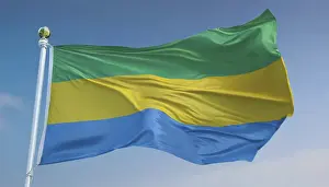 Drucke von Die Flagge Gabuns weht im Wind, isoliert gegen einen blauen Himmel Gabun Drucke: Die Flagge Gabuns weht in der Windböe