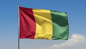Flag Fluttering In Wind Drucke: The flag of Guinea, fluttering in the wind