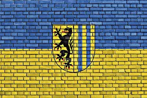 European Flag Design Drucke: Flag of Leipzig painted on brick wall