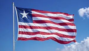 Drucke von Das Flagge von Liberia flattert im Wind, isoliert, gegen den blauen Himmel Liberia Drucke: Das Flagge von Liberia weht im Wind.