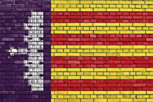 Mallorca Travel Photography Drucke: Flag of Majorca painted on brick wall