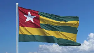 Drucke von Die Flagge von Togo flattert im Wind, isoliert gegen einen blauen Himmel Togo Drucke: Die Flagge von Togo flattert im Wind.