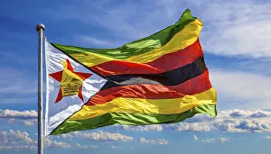 Blue Sky Background Images Drucke: The flag of Zimbabwe, fluttering in the wind