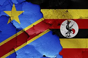 Drucke von Fahnen der DR Kongo und Uganda auf einem gekrümmten Wand gemalt Republik Kongo Drucke: Fahnen der DR Kongo und Uganda auf einer gekrümmten Wand gemalt.