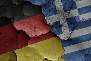Deserted Wall Painting Drucke: Flags of Germany and Greece painted on cracked wall