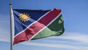 Empty Landscape With Flag Drucke: Flags, the national flag of Namibia flutters in the wind
