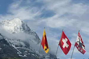 Swiss National Flag Drucke: Flags in front of the snow-covered Eiger Mountain