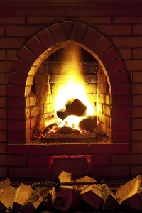 Fire In Fireplace Drucke: Flames of fire in fireplace in evening time