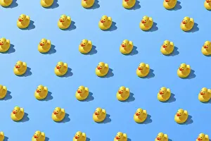 Text Free Space For Copy Drucke: Flat lay of a creative summer yellow rubber duck pattern
